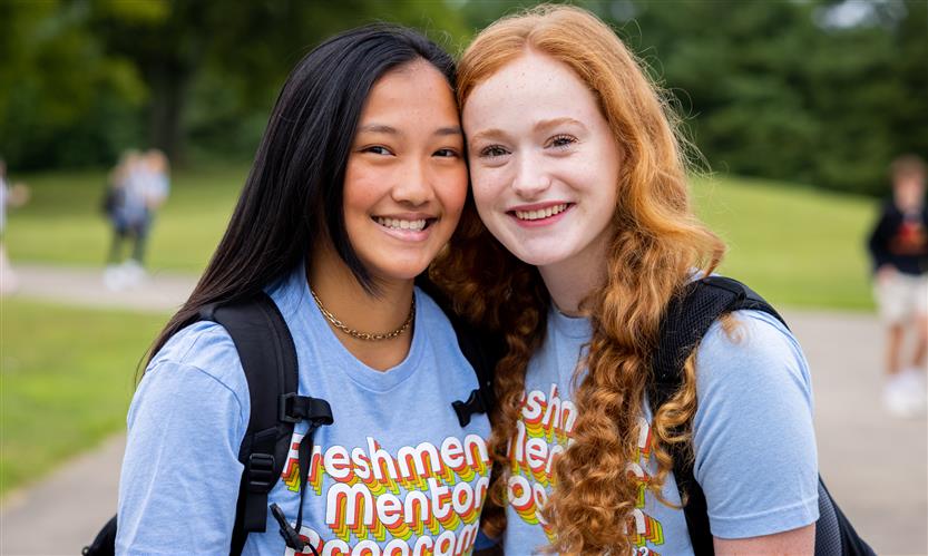 Two girls smile